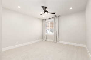 Carpeted empty room featuring recessed lighting and ceiling fan