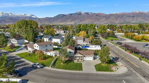 Aerial view of residential area featuring a mountain backdrop