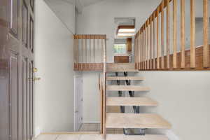 Stairs featuring tile patterned floors