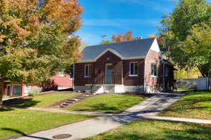 View of front of home featuring a shingled roof