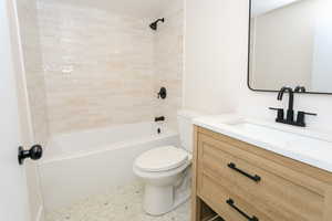 Bathroom featuring  shower combination and vanity