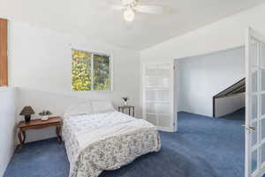 Bedroom with carpet floors and a ceiling fan