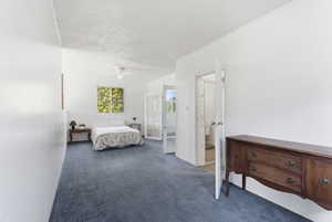 Bedroom featuring carpet floors and ceiling fan
