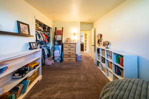Bedroom with carpet floors and a closet