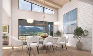 Dining space featuring a towering ceiling, a wood ceiling with exposed beams, wood finished floors, and a mountain view