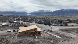View of mountain backdrop featuring nearby suburban area