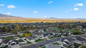 Aerial perspective of suburban area featuring a mountain backdrop