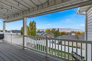 Deck with a mountain view and a residential view