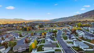 Aerial view of residential area featuring a mountain backdrop