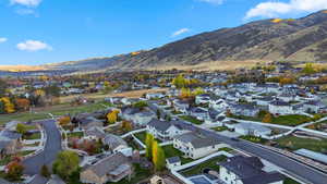 Aerial view of residential area featuring a mountain backdrop