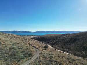 View of mountain backdrop featuring a nearby body of water