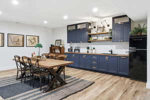 Dining room featuring light wood-type flooring and recessed lighting