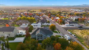 Aerial perspective of suburban area featuring a mountainous background