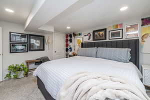 Carpeted bedroom featuring recessed lighting