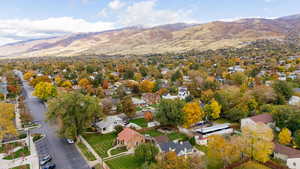 View of property location with a mountain backdrop and nearby suburban area