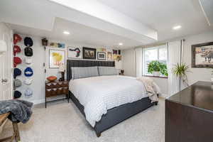 Carpeted bedroom with baseboards and recessed lighting