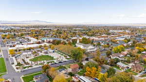 Aerial view of property's location featuring a mountain backdrop and nearby suburban area