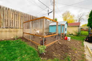 View of yard with exterior structure and an outbuilding