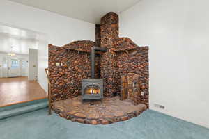 Detailed view of carpet and a wood stove