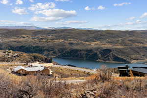 Mountain view featuring a nearby body of water