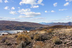 View of mountain backdrop featuring a large body of water
