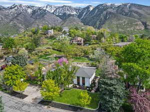 Aerial view of property and surrounding area featuring mountains
