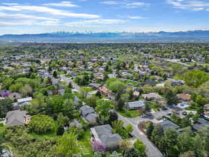 Aerial view of residential area featuring a mountainous background