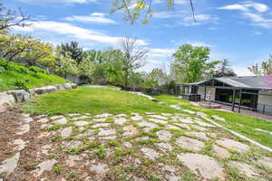 View of yard with a patio area