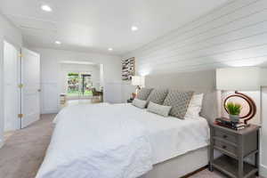 Bedroom with carpet floors, recessed lighting, and attic access