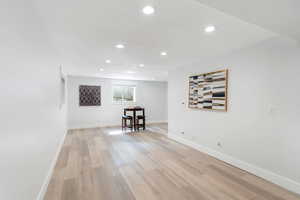 Empty room featuring recessed lighting and light wood-style floors