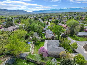 Aerial perspective of suburban area with a mountainous background