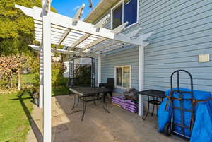 View of patio / terrace featuring a pergola and outdoor dining area