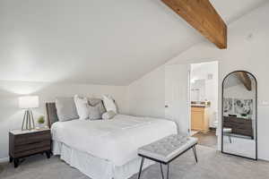 Bedroom with light colored carpet