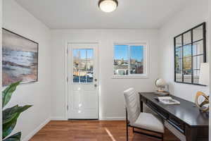 Home office with wood finished floors and plenty of natural light