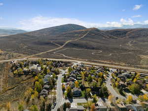 View of property location featuring nearby suburban area and a mountainous background
