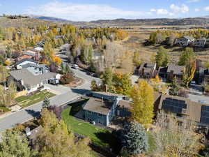 Aerial perspective of suburban area with a mountainous background