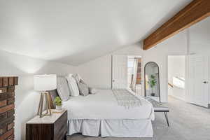 Carpeted bedroom featuring connected bathroom