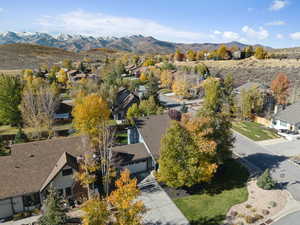 Aerial perspective of suburban area featuring a mountain backdrop