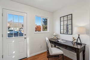 Office area featuring wood finished floors and baseboards
