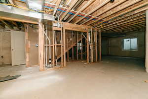 Basement featuring heating unit