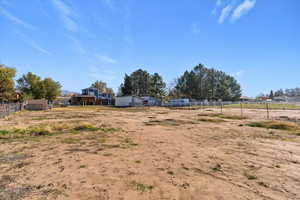 View of yard with a view of rural / pastoral area and an outdoor structure