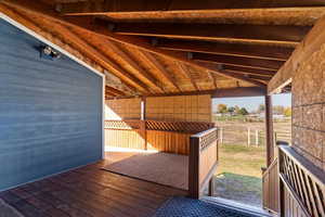 Wooden terrace featuring a view of countryside