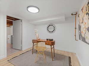 Office featuring light wood finished floors and washer / clothes dryer