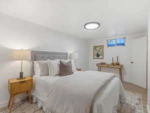 Bedroom with baseboards and light wood-style floors