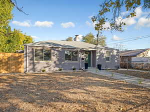 Ranch-style home with a chimney