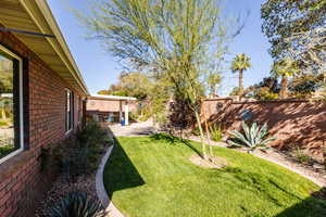 Fenced backyard featuring a patio