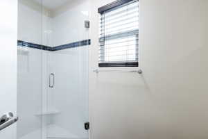 Full bath with a shower stall