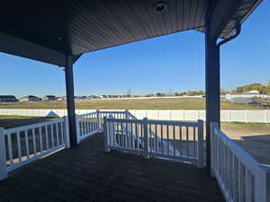 Deck with a fenced backyard and a residential view
