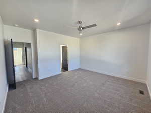 Unfurnished room with dark carpet, recessed lighting, and ceiling fan