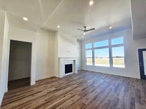 Unfurnished living room featuring recessed lighting, a fireplace, wood finished floors, and a ceiling fan